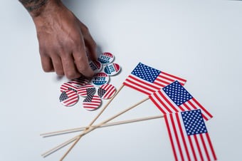 Canva - American Flags and Pins on White Background